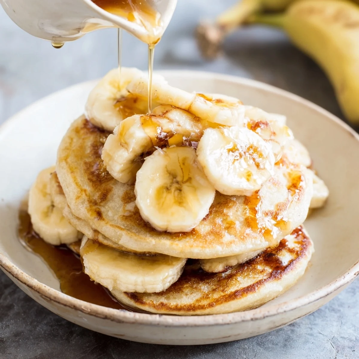 Imagine enjoying a stack of Weekend Golden-Brunch Banana Pancakes, cooked perfectly and ready for every bite.