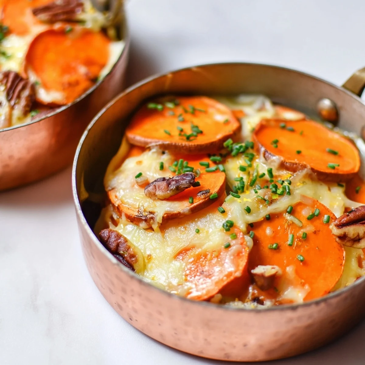 Golden, baked Copper Penny Warmth: A comforting autumn appetizer layered with roasted veggies and melted cheddar.