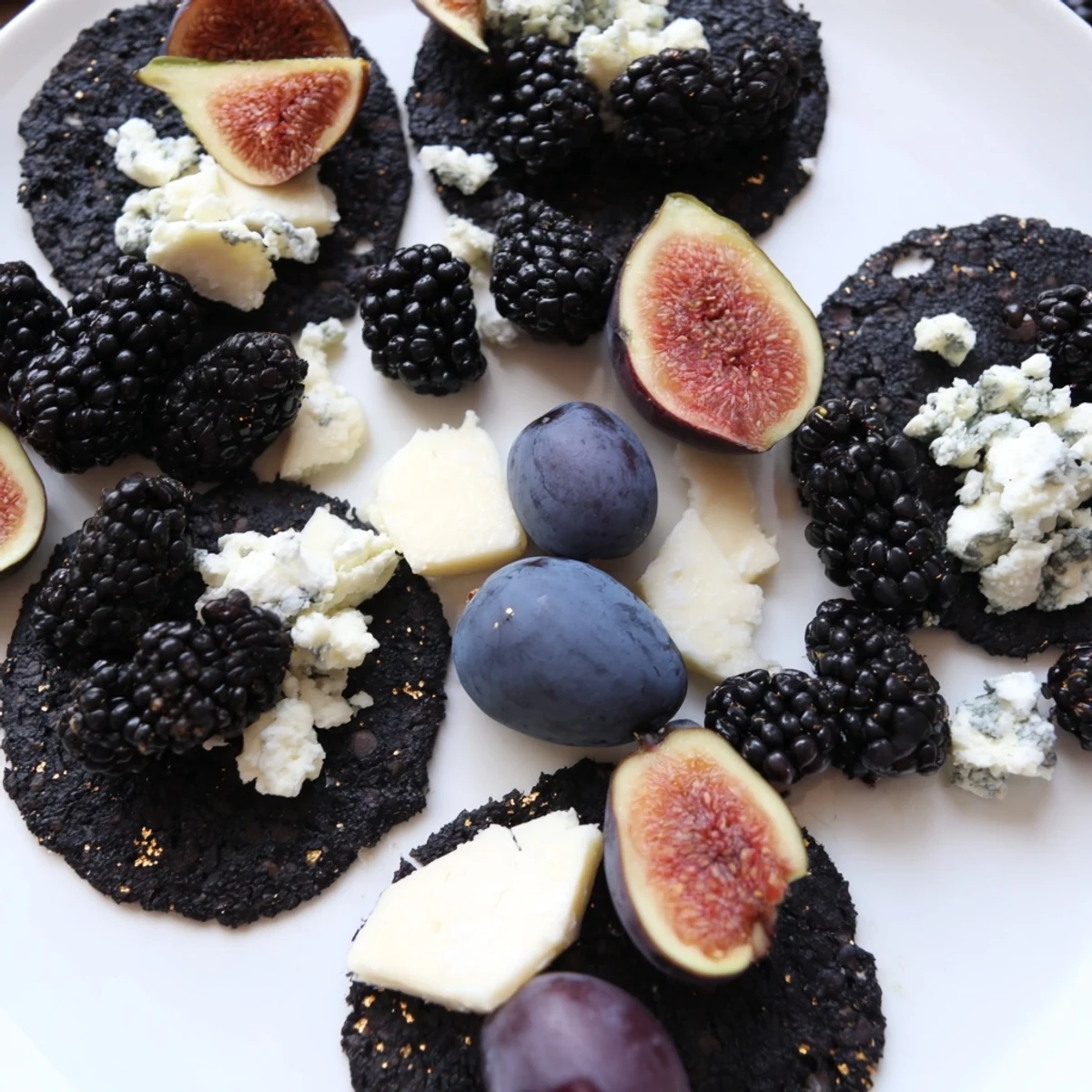 A Deep Indigo Midnight Sky cheese board, overflowing with blackberries, figs, and creamy goat cheese.