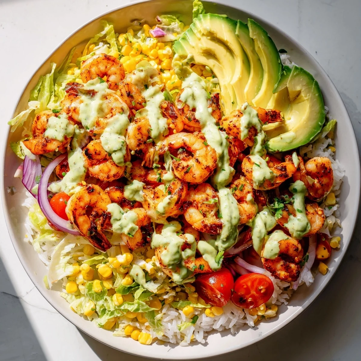 Cajun shrimp taco bowls, filled with colorful vegetables and seasoned shrimp, are ready to eat.
