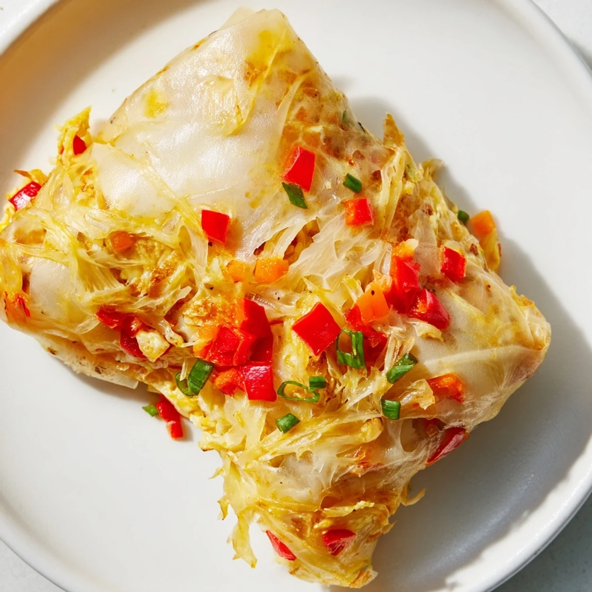 Golden, crispy Rice Paper Egg Cheese Wrap boasts oozing melted cheese and a satisfying, crunchy bite.