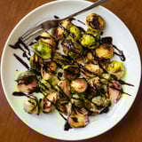 Roasted Brussels sprouts with balsamic reduction, golden-brown edges, and a glossy drizzle for a sweet-savory bite.
