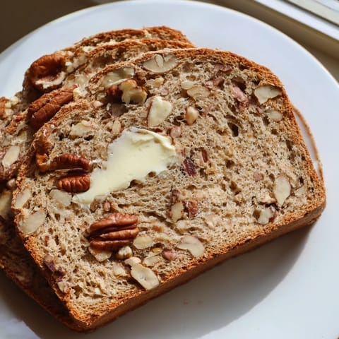 Golden-crusted Nutty Whole Wheat Loaf Bread; imagine the aroma wafting from the oven, ready to slice.