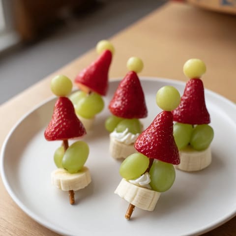Freshly assembled Elf Hat Strawberry Skewers showcase vibrant fruit ready to be enjoyed as a playful treat.