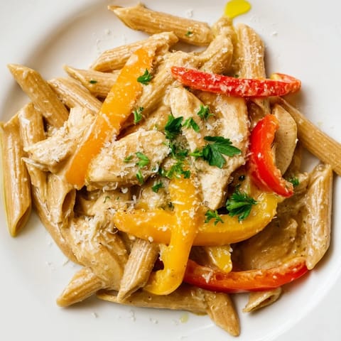 A lighter take on the classic, this dish showcases al dente pasta coated in a smooth, Cajun-spiced sauce with sautéed vegetables.  