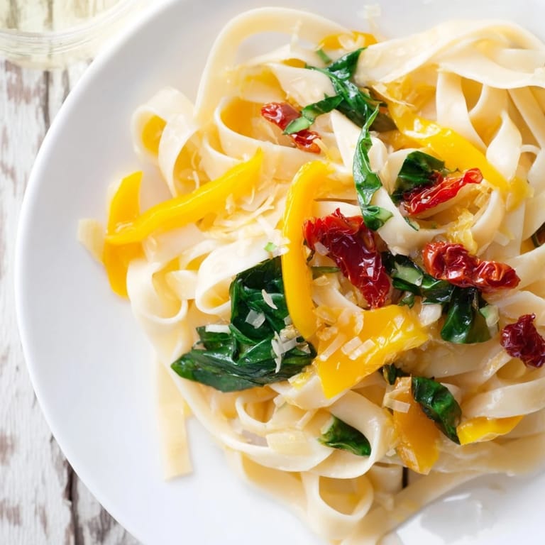 Close-up of a rich, comforting One-Pot Creamy Tuscan Garlic Herb Pasta, perfectly plated and appealing.